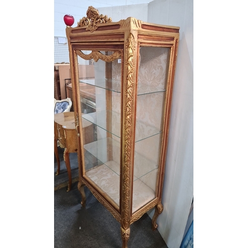 1154 - Star lot : A stunning Ornately carved gilt display cabinet with curved glass panels, rococo detailin... 