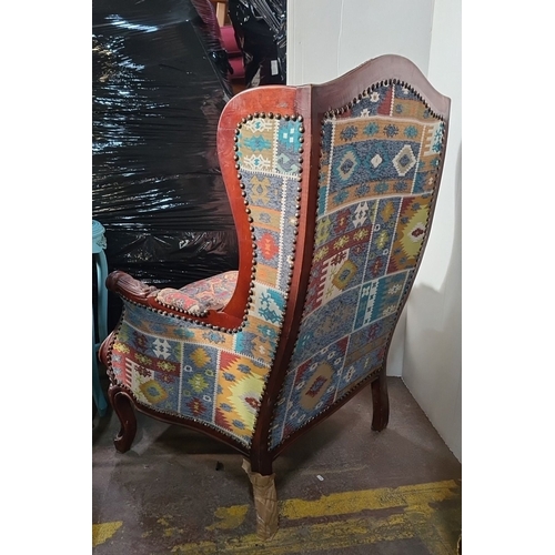 1163 - Star Lot : A fabulous large Wingback armchair with ornate carved wood frame and vibrant upholstered ... 