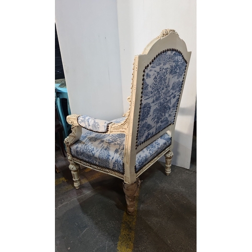 1164 - Star Lot : A large Carved French-style upholstered armchair featuring blue toile fabric and intricat... 