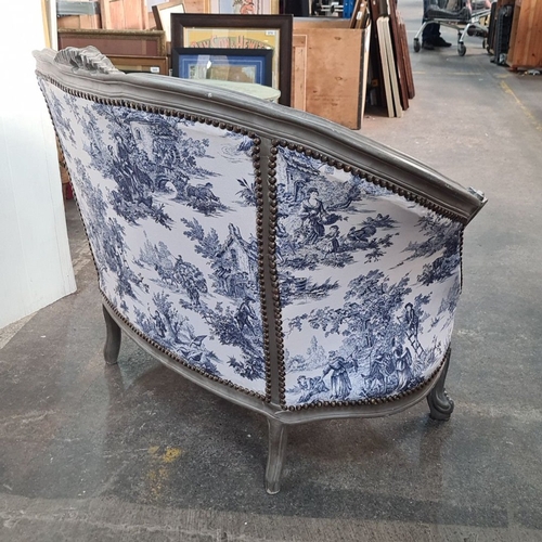 1176 - Star Lot : Louis XV style bergère with blue and white toile upholstery, featuring carved wood detail... 