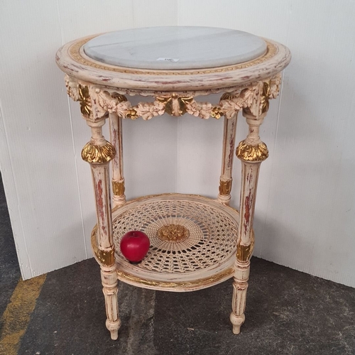 1180 - Star lot : Carved French-style side table with gold accents and an Italian marble top, featuring orn... 