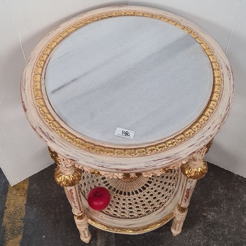 1180 - Star lot : Carved French-style side table with gold accents and an Italian marble top, featuring orn... 