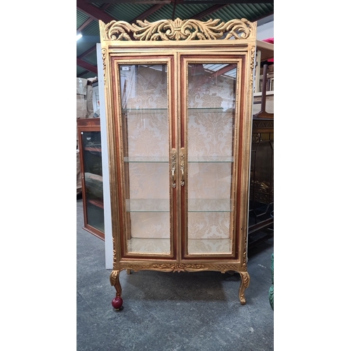 1181 - Star Lot : A full size Gilt display cabinet with ornate carvings, glass shelves, and damask interior... 