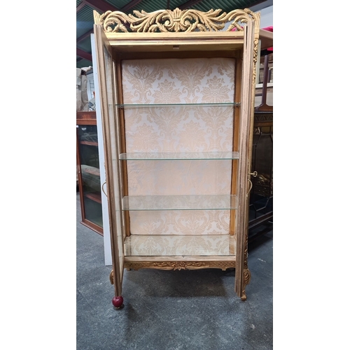 1181 - Star Lot : A full size Gilt display cabinet with ornate carvings, glass shelves, and damask interior... 