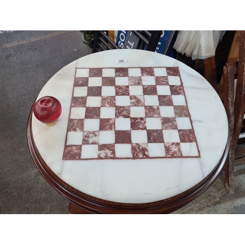 1188 - Star Lot : A super Victorian-style round chess table with a cold Italian marble top and inlaid check... 