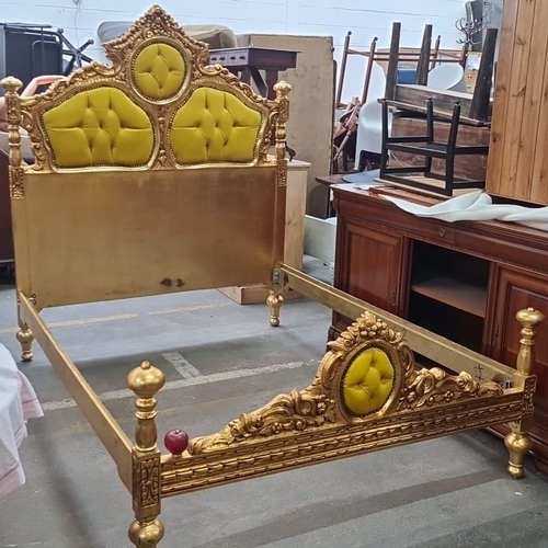 1189 - Star Lot : A majestic Gilded wooden bed frame featuring ornate detailing and plush yellow upholstery... 