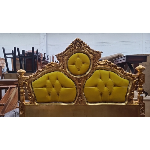 1189 - Star Lot : A majestic Gilded wooden bed frame featuring ornate detailing and plush yellow upholstery... 