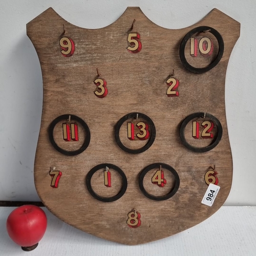 984 - Vintage wooden ring toss game board with painted numbers and hooks. Shield-shaped design with accomp... 