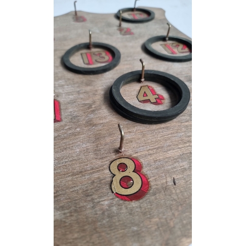 984 - Vintage wooden ring toss game board with painted numbers and hooks. Shield-shaped design with accomp... 