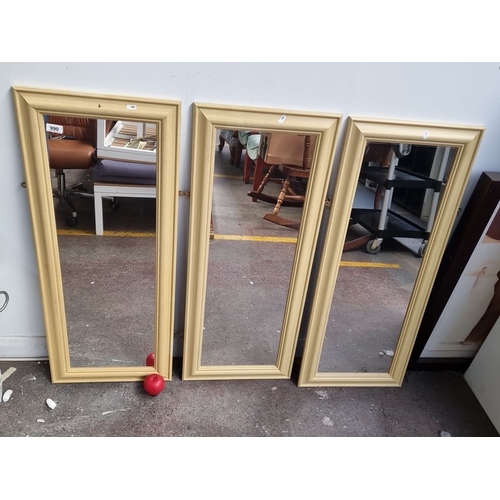 990 - Set of three rectangular mirrors with gold-toned frames. Simple and elegant design.