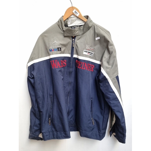 991 - Mercedes Benz Mobil 1 team jacket features embroidered logos and zip pockets. XL