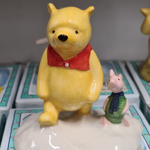 131 - Star Lot : A selection of nine Royal Doulton figurines from the Winnie-the-Pooh collection, includes... 