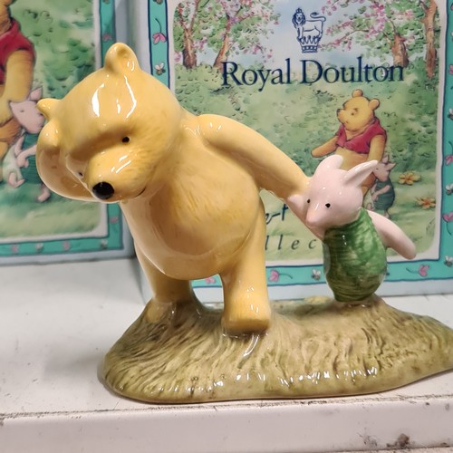 131 - Star Lot : A selection of nine Royal Doulton figurines from the Winnie-the-Pooh collection, includes... 