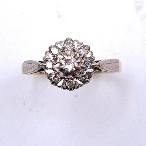 398 - Star Lot : A lovely 18ct Gold Diamond Flower ring. 3.36g  with 9 diamonds, center stone approx 0.35c... 