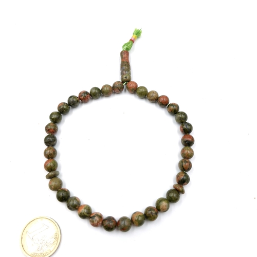 1212 - A quartz polished bead necklace. Weight - 31 grams. Stones cold to the touch. Previously in 31.10.24... 