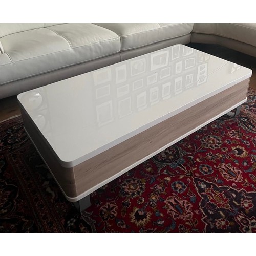 995 - Star lot : A fabulous white gloss coffee table with spring loaded top that lifts up to reveal storag... 