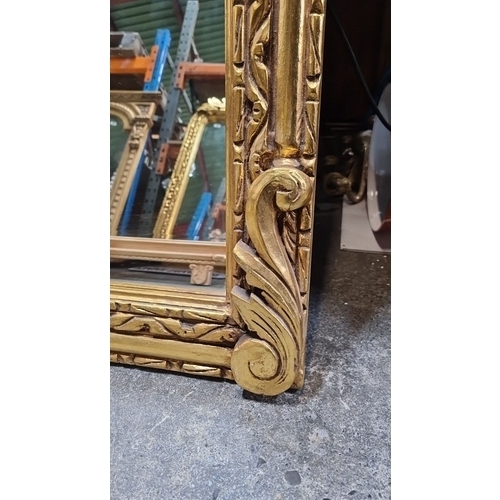 1197 - Star Lot : a large impressive Giltwood mirror with intricate carved laurel leaf and fruit design, Cl... 