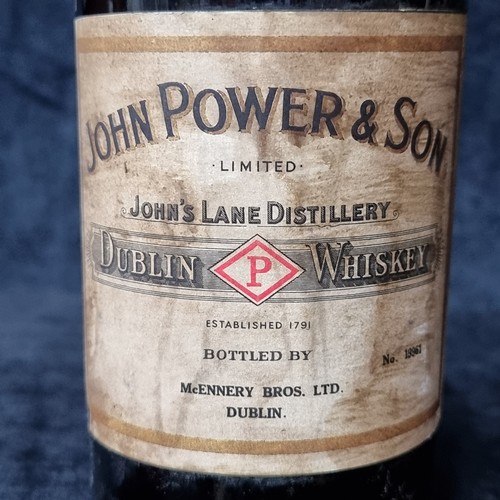 757 - Star lot : A vintage bottle of John Powers & son Dublin Whiskey. Mcennery Bothers Ltd Dublin. Sealed... 