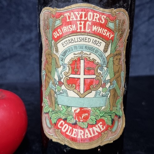 665 - Star lot : A vintage bottle of Taylor's Old irish H.C Whisky. 