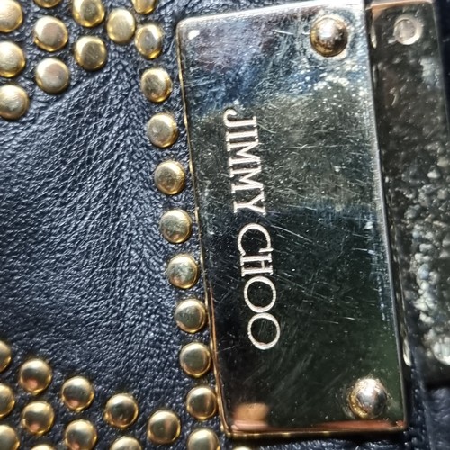 1028 - An original designer Jimmy Choo black leather gold studded zulu zipper top clutch bag. RRP: $279 Ser... 