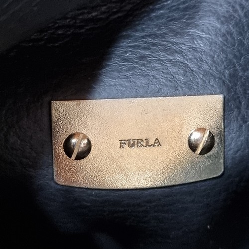 1032 - An original designer Furla grained leather shoulder bag complete with brass hardware and dust bag. R... 