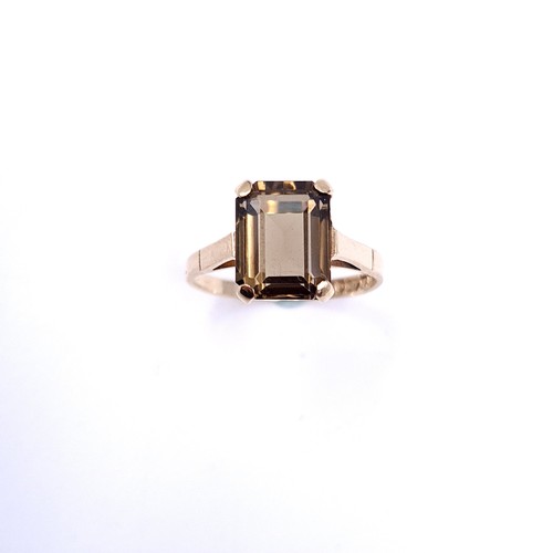 2 - A nine carat gold smoky quartz ring with claw mount. Size - M 1/2. Weight - 2.4 grams.