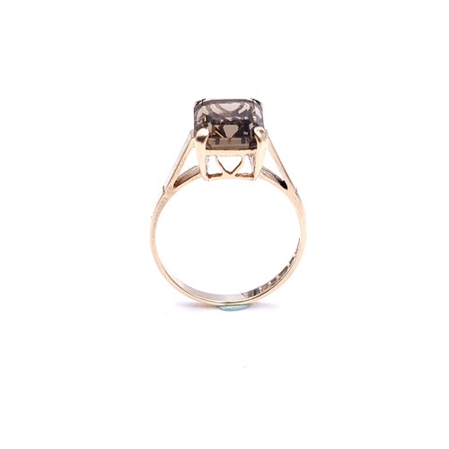 2 - A nine carat gold smoky quartz ring with claw mount. Size - M 1/2. Weight - 2.4 grams.