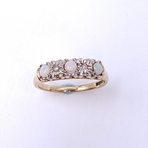 4 - Star Lot : A nine carat gold (375) opal and diamond set ring. Ring size - N. Weight - 2.35 grams.