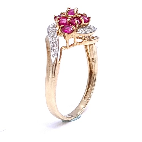 5 - Star Lot : A nine carat gold (375) twist mount ruby and diamond cluster ring. Ring size - O. Weight ... 