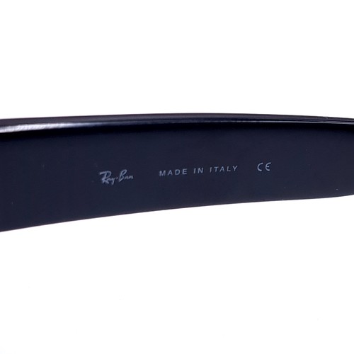 15 - A pair of wrap round Ray-Ban sunglasses 'Made in Italy'. Lenses clear . Comes in Ray-Ban box.