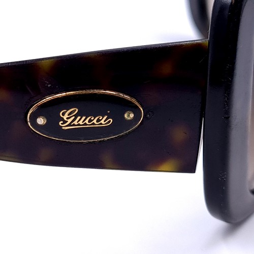 16 - A pair of Gucci sunglasses 'Made in Italy' with reference nos to frame.