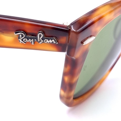 20 - A pair of Ray-Ban sunglasses marked USA set in faux tortoise shell frames. Wayfarer marked to frame.... 