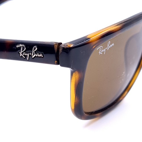 21 - A pair of Ray-Ban sunglasses with faux tortoise shell frames and serial nos to frame. Lenses show sl... 