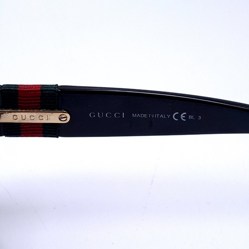 25 - A pair of Gucci sunglasses marked 'Made in Italy' with attractive detailing to frames.  Comes in Guc... 