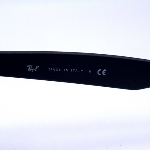 26 - A pair of Ray-Ban black framed sunglasses marked 'Made in Italy' with serial nos to frames. Lenses c... 