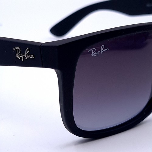 26 - A pair of Ray-Ban black framed sunglasses marked 'Made in Italy' with serial nos to frames. Lenses c... 