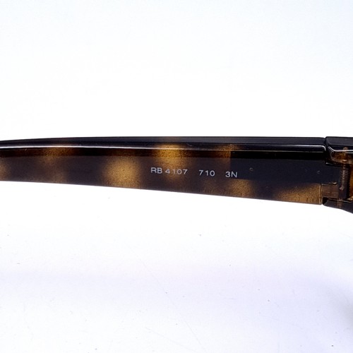 27 - A pair of Ray-Ban 'Made in Italy' faux tortoise shell sunglasses. Serial nos to frames. Lenses clear... 