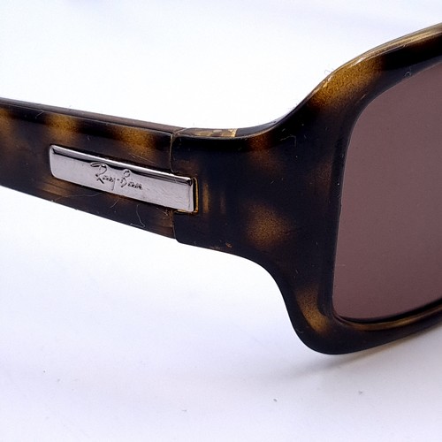 27 - A pair of Ray-Ban 'Made in Italy' faux tortoise shell sunglasses. Serial nos to frames. Lenses clear... 