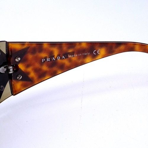 28 - A pair of Prada 'Made in Italy' wrap round sunglasses. Serial nos to frames. Comes in presentation b... 