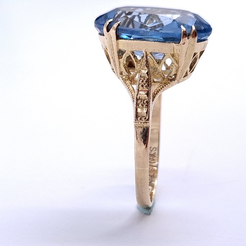 30 - Star Lot : A Fabulous Large blue topaz gemstone ring set in nine carat gold. Size - Q. Weight - 5.1 ... 