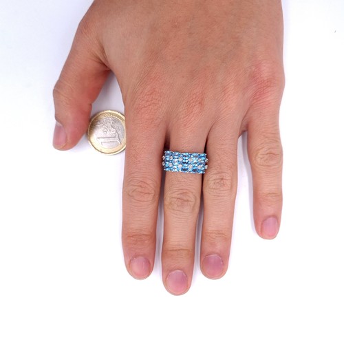 31 - A nine carat white gold ring set with blue topaz stone cluster mount with diamonds. Ring size - N. W... 