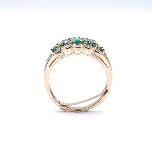 35 - Star Lot : A stunning five gemstone emerald ring with diamonds in 9ct gold . Ring size - P. Weight -... 