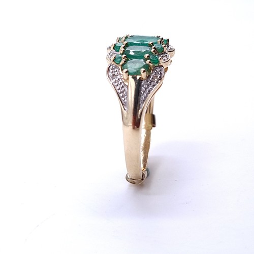 35 - Star Lot : A stunning five gemstone emerald ring with diamonds in 9ct gold . Ring size - P. Weight -... 