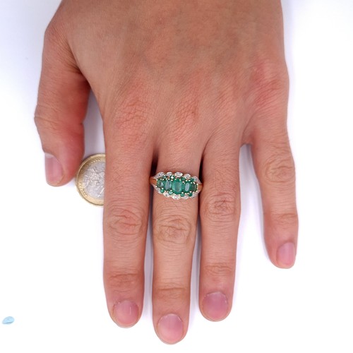 35 - Star Lot : A stunning five gemstone emerald ring with diamonds in 9ct gold . Ring size - P. Weight -... 