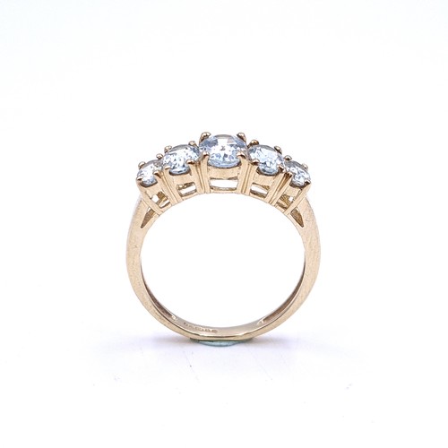 36 - Star Lot : A beautiful five stone graduated aquamarine ring set in nine carat gold. Ring size - O 1/... 