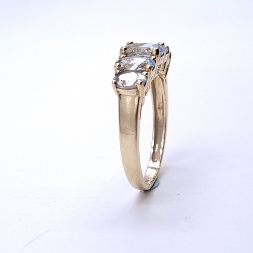 36 - Star Lot : A beautiful five stone graduated aquamarine ring set in nine carat gold. Ring size - O 1/... 