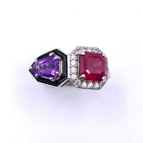 553 - An unusual ruby & amethyst stone ring with white sapphire mount set in sterling silver. Size - M. We... 