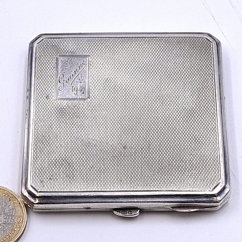 585 - A sterling silver hallmarked Birmingham glazed powder compact with machine cut detailing. Dimensions... 