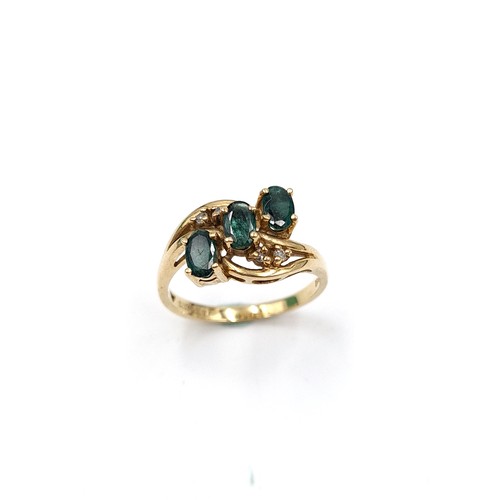 1075 - Star Lot : A stunning 9ct Gold ring with Emeralds and Diamonds. 
Size: M  Total weight: 2.9 g