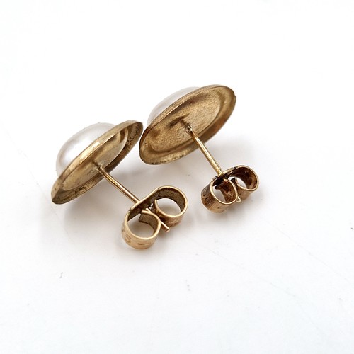 1079 - A classic pair of gold and pearl earrings. Total Weight: 0.6 g